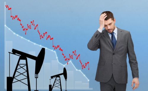 businessman with forex chart and pumpjacks